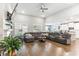 Spacious living room featuring a sectional sofa, hardwood floors, and a fireplace at 445 Carmichael Cir, Canton, GA 30115