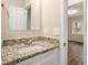 Clean bathroom with granite countertop and white vanity at 1903 Meadow Ln, Decatur, GA 30032