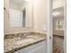 Updated bathroom with granite countertop and a new vanity at 1903 Meadow Ln, Decatur, GA 30032