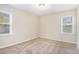 Cozy bedroom with neutral carpet and ample natural light at 1903 Meadow Ln, Decatur, GA 30032