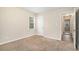 Bright bedroom featuring carpet and access to a hallway at 1903 Meadow Ln, Decatur, GA 30032