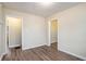 Bright hallway with neutral walls and doors to other rooms at 1903 Meadow Ln, Decatur, GA 30032