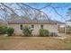 Brick house exterior showcasing a side yard and landscaping at 1903 Meadow Ln, Decatur, GA 30032