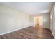 Open living room with hardwood floors and access to other rooms at 1903 Meadow Ln, Decatur, GA 30032
