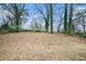 Large backyard with mature trees and open space at 1983 Wee Kirk Se Rd, Atlanta, GA 30316