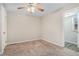 Bright bedroom with ceiling fan and neutral carpeting at 1983 Wee Kirk Se Rd, Atlanta, GA 30316