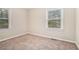 Well-lit bedroom with neutral walls and carpet at 1983 Wee Kirk Se Rd, Atlanta, GA 30316