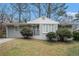 Gray Ranch house with manicured lawn and shrubs at 1983 Wee Kirk Se Rd, Atlanta, GA 30316