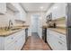 Modern kitchen with granite countertops and white cabinets at 1983 Wee Kirk Se Rd, Atlanta, GA 30316