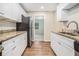 Eat-in kitchen, granite countertops, white cabinets at 1983 Wee Kirk Se Rd, Atlanta, GA 30316