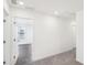 Upstairs hallway with carpet and access to bedrooms at 293 Bald Ave, Stockbridge, GA 30253