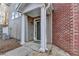 Inviting front entrance with columns and a dark-colored door at 2700 Pierce Brennen Ct, Lawrenceville, GA 30043