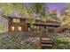 Elevated home with large deck and stairs leading down at 2612 Country Club Se Dr, Conyers, GA 30013