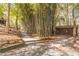 Gravel path meanders through a bamboo forest to a shed at 2612 Country Club Se Dr, Conyers, GA 30013