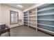 Finished basement room with built-in shelves and window at 2612 Country Club Se Dr, Conyers, GA 30013