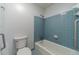 Clean bathroom with shower/tub combo and light blue tile at 2612 Country Club Se Dr, Conyers, GA 30013