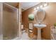 Small bathroom with pedestal sink and shower at 2612 Country Club Se Dr, Conyers, GA 30013