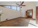 Spacious main bedroom with ceiling fan and large windows at 2612 Country Club Se Dr, Conyers, GA 30013