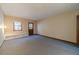 Spacious bedroom with built-in shelving and carpet at 2612 Country Club Se Dr, Conyers, GA 30013