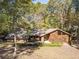 Brick and wood house with a spacious yard at 2612 Country Club Se Dr, Conyers, GA 30013