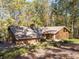 Ranch home with attached garage and mature trees at 2612 Country Club Se Dr, Conyers, GA 30013