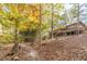 Home's side view from wooded area path at 2612 Country Club Se Dr, Conyers, GA 30013