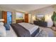Main bedroom with gray platform bed and large TV at 2612 Country Club Se Dr, Conyers, GA 30013
