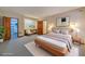 Main bedroom with wood platform bed and walk-in closet at 2612 Country Club Se Dr, Conyers, GA 30013