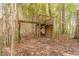 Wooden playset nestled in bamboo forest at 2612 Country Club Se Dr, Conyers, GA 30013