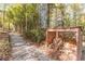 Covered woodpile next to a path in wooded setting at 2612 Country Club Se Dr, Conyers, GA 30013