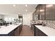 Modern kitchen with dark cabinets, herringbone backsplash, and stainless steel appliances at 4195 Waratah Way, Mableton, GA 30126