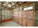 Unfinished basement area with wire shelving and insulation at 147 Hubbard Rd, Woodstock, GA 30188