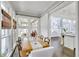 Bright dining room with a farmhouse table and views to the kitchen at 147 Hubbard Rd, Woodstock, GA 30188