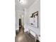 Bright hallway with dark hardwood floors, leading to other rooms at 147 Hubbard Rd, Woodstock, GA 30188