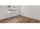 Bright bedroom featuring beautiful wood floors, a large window and white trim at 3650 Olive Grove Ln, Covington, GA 30016
