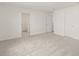 Spacious carpeted bedroom with multiple doors at 3650 Olive Grove Ln, Covington, GA 30016