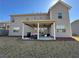 Spacious backyard with covered patio, perfect for outdoor entertaining and relaxation at 3330 Deaton Trl, Buford, GA 30519