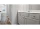 Bathroom vanity with a white countertop, a sink, and wood-look floors at 3330 Deaton Trl, Buford, GA 30519