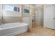 Modern bathroom featuring a glass shower and separate tub, designed for comfort and style at 3330 Deaton Trl, Buford, GA 30519