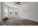 Bright bedroom with a ceiling fan and multiple windows offering plenty of natural light at 3330 Deaton Trl, Buford, GA 30519