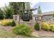 Stone entrance to community with 'Deaton Farm' sign, landscaping, and decorative stonework at 3330 Deaton Trl, Buford, GA 30519