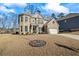 Charming brick home with a well-manicured lawn, showcasing curb appeal and a welcoming facade at 3330 Deaton Trl, Buford, GA 30519