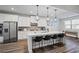 Modern kitchen with stainless steel appliances, white cabinets, and spacious center island at 3330 Deaton Trl, Buford, GA 30519