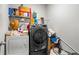 Laundry room featuring a washer, dryer, and shelving for storage, providing convenience and organization at 3330 Deaton Trl, Buford, GA 30519