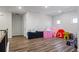 Large playroom with wood-look floors and plenty of space for toys at 3330 Deaton Trl, Buford, GA 30519