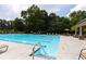 Community pool featuring a shallow end and lots of seating at 3330 Deaton Trl, Buford, GA 30519