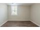 Empty basement bedroom with dark wood-look flooring at 4412 Rustic Wood Dr, Stone Mountain, GA 30083