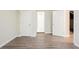 Basement with wood-look flooring and multiple doors at 4412 Rustic Wood Dr, Stone Mountain, GA 30083