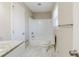 Updated bathroom with granite vanity, tile flooring, and bathtub at 4412 Rustic Wood Dr, Stone Mountain, GA 30083