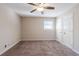 Bedroom with ceiling fan, neutral walls and carpet flooring at 4412 Rustic Wood Dr, Stone Mountain, GA 30083